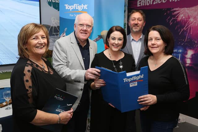 Representative of Top Flight with local representatives.