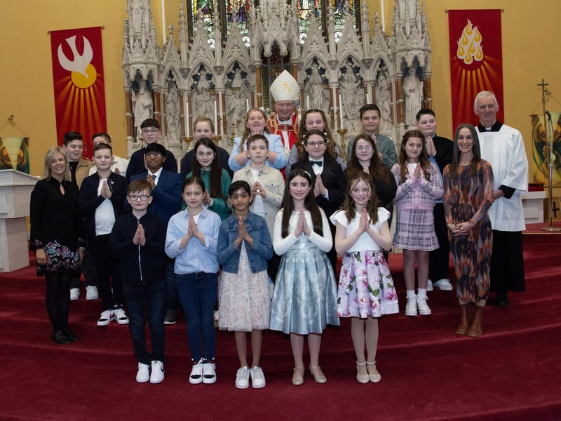 Pupils from Good Shepherd Primary School, Waterside, Derry who received the Sacrament of Confirmation from Dr. Donal McKeown, Bishop of Derry, on Friday afternoon last. Included in photo are from left, Mrs. Suzann McCafferty, Principal, and on right, Mrs. Forbes, P7 Teacher, and Fr. Michael Canny. (Photos: Jim McCafferty Photography)