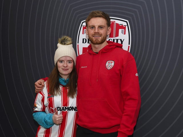Candystripe fan Aoibheann Dunleavy pictured with Derry City's Rob Slevin at the club's merchandise outlet in Foyleside Shopping Centre. Photo: George Sweeney
