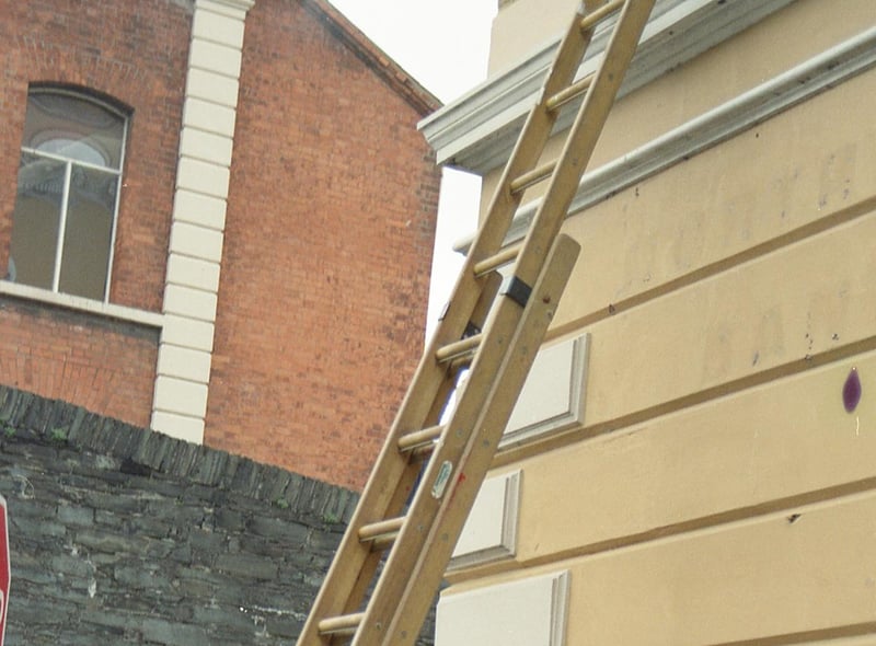 RUC officers arrive on the scene as the first city centre street signs in Irish are erected at Shipquay Street in 1992.