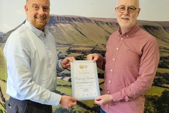 Phillip Brady, Founder and CEO of An Margadh Limited  (right) collecting his Ulster Farmer's Union Corporate Membership Certificate from Craig Scott from UFU.