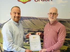 Phillip Brady, Founder and CEO of An Margadh Limited  (right) collecting his Ulster Farmer's Union Corporate Membership Certificate from Craig Scott from UFU.