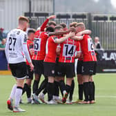 Derry City players celebrate Ben Doherty's opening goal on the stroke of half-time at Oriel Park. Photograph by Kevin Moore.