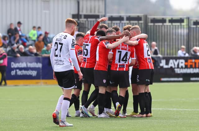 Derry City players celebrate Ben Doherty's opening goal on the stroke of half-time at Oriel Park. Photograph by Kevin Moore.