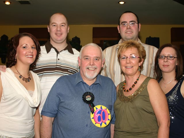 Tony having a good time at his 60th party with daughter Kelly, wife Paula back row Brian, son Martin and Clare. 2311/dd