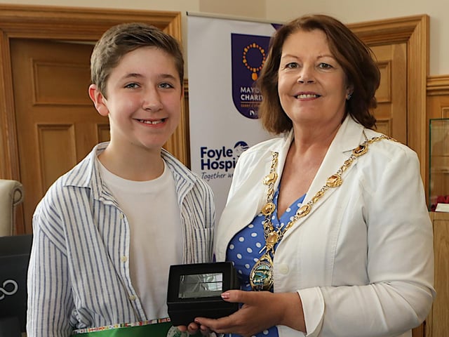 Mayor Patricia Logue presents a gift to Joshua Concannon, World Champion Irish Dancer. (Photo - Tom Heaney, nwpresspics)