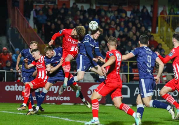 Cameron McJannet rises to head the ball under pressure during the first half against Sligo Rovers. Photograph by Kevin Moore (MCI)