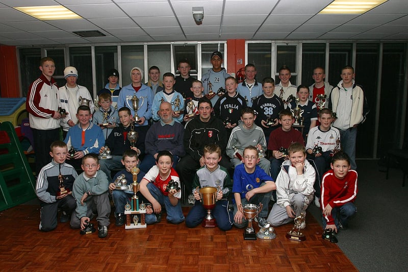 Derry City defender Peter Hutton (seated, centre) who was the special guest when he presented medals and Player of the Year awards at the presentation of prizes at the Don Boscos junior club's annual presentation of awards held at the Templemore Sports Complex.