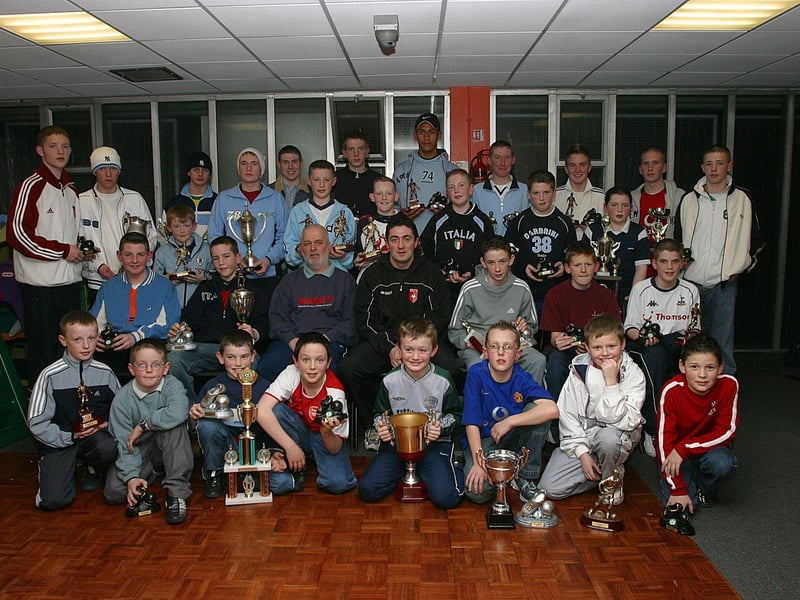 Derry City defender Peter Hutton (seated, centre) who was the special guest when he presented medals and Player of the Year awards at the presentation of prizes at the Don Boscos junior club's annual presentation of awards held at the Templemore Sports Complex.