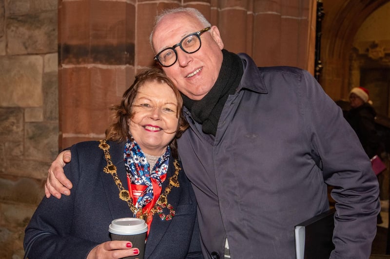Pat Armstrong from Hive Choir pictured with Derry City and Strabane District Council Mayor, Councillor Patricia Logue as she hosts a Countdown to Christmas family night in Guildhall Square with compere Michael Doherty.  Picture Martin McKeown. 21.12.23