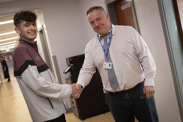 Lee Mosby, Head of Geography at St. Columb's College congratulates former student Sam Brattin on his success at the London Marathon last week.