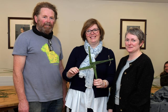 Carmel O’Neill, holding her completed St Brigid’s cross, pictured with weaver Brendan Farren and  Arts Centre Coordinator Judi Logue on Wednesday morning.  Photo: George Sweeney