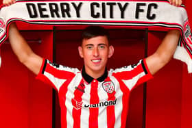 CUP AMBITIONS . . . Darragh Burns is unveiled as a Derry City supporter this week.