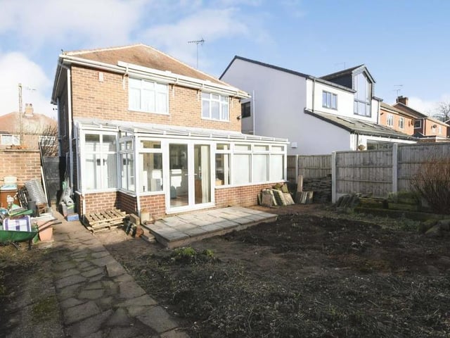Stepping back outside now, and this is the view from the back of the Prospect Street property. The rear garden is private and enclosed, with a secure fenced boundary and a decked seating area.