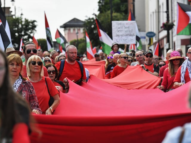 The ‘Turn Shipquay Street Red for Gaza’ march makes its way along Bishop Street  towards Shipquay Street on Saturday afternoon. Photo: George Sweeney