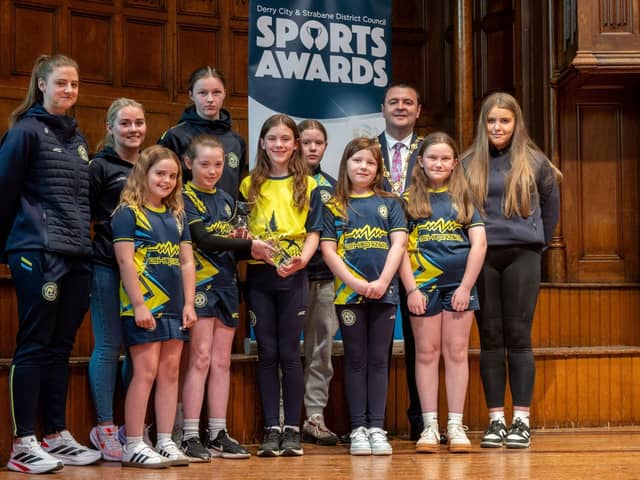 The Mayor, Councillor Ruairí McHugh, pictured with players and coaches from Sion Swifts Ladies and Girls FC, who received the Club of the Year Award, as he hosted the annual Derry City and Strabane District Council Sports Awards in the Guildhall. Picture Martin McKeown. 05.06.25