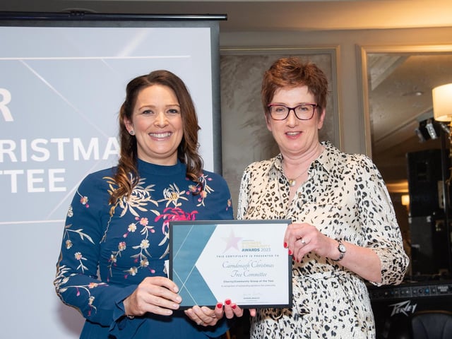 Sally Kelly, Carndonagh Christmas Tree Committee receiving The Charity / Community Group of the Year Award from Grainne Gillen Inishowen Credit Union, Award Sponsor at the Carndonagh Traders Business and Community Awards in the Ballyliffin Lodge Hotel on Saturday night last. Photo Clive Wasson.