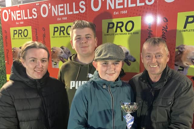 Dan and Jackie Begley kindly sponsored the Townparks Kennels trophy and it was presented to Shane Talbot by Eamon Porter (right) after Train Flash was voted joint favourite performer at the recent meeting. Ceallach and Rian Talbot are also in photograph.