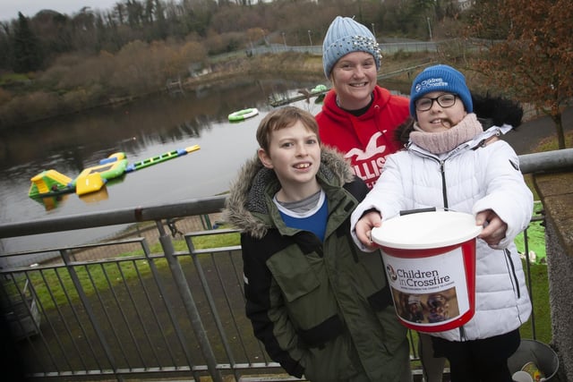 St. Joseph’s Boys School teacher Fiona Page pictured with her children Kitty (10) and Peter (9), supporting her pier jump for Children in Crossfire on Saturday last the Creggan Reservoir.