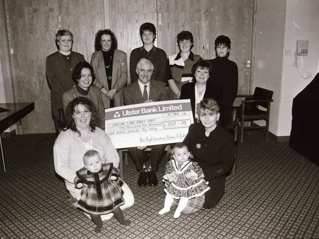 Hilghlanders Wives present cheque to Special Baby Unit.