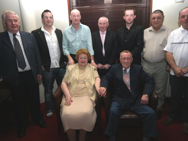 Charlie, Marc, Martin, Hugo, shaun, Johnnie and Michael celebrates with Kathleen and Willie at Pitchers 0159JML : Parties and celebrations January 2006: Kathleen and Willie Quigley.