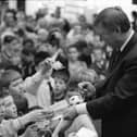 Manchester United manager Alex Ferguson signs autographs during a visit to Foyleside Shopping Centre.