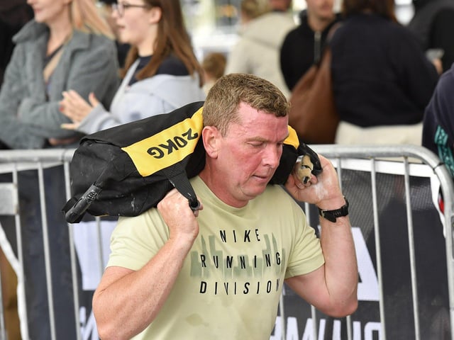 This competitor tackles the walking lunges station at Ebrington Hyrox on Saturday morning. Photo: George Sweeney