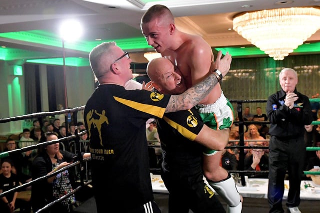 Rathmor Warriors’ Jake Mooney celebrates his defeat of Dennis Lafferty, SMAA, to win the Lightweight LK Irish Title, on Saturday evening last, in the Everglades Hotel. Photo: George Sweeney. DER2312GS – 72