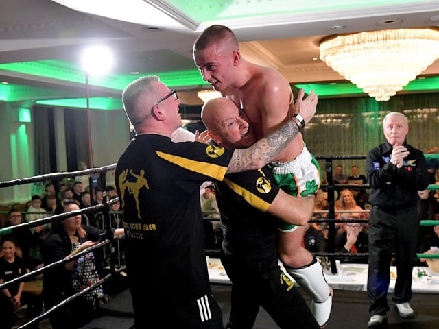 Rathmor Warriors’ Jake Mooney celebrates his defeat of Dennis Lafferty, SMAA, to win the Lightweight LK Irish Title, on Saturday evening last, in the Everglades Hotel. Photo: George Sweeney.  DER2312GS – 72