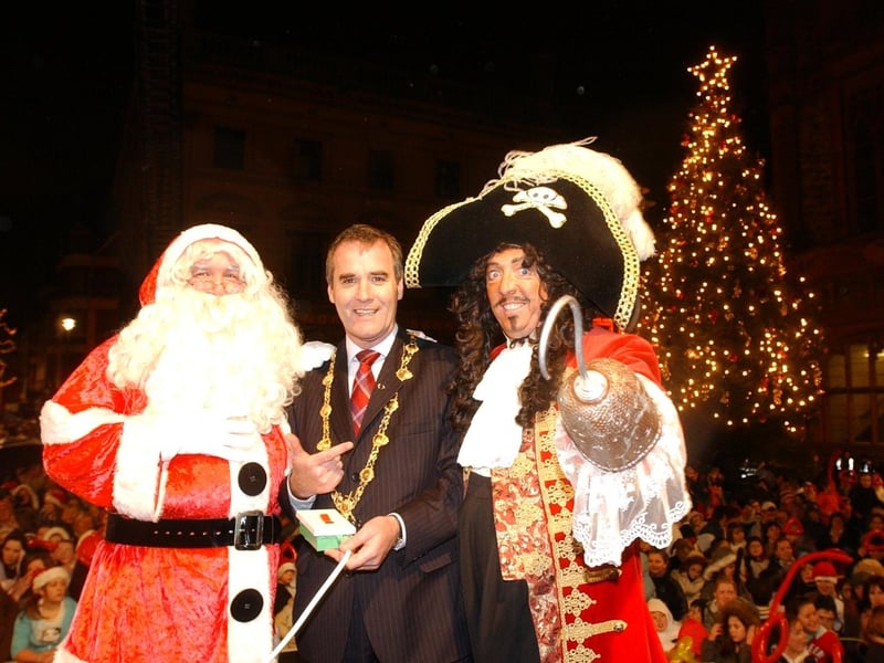 HELPING HAND & HOOK! - The Mayor of Derry, Councillor Gearoid O'hEara, switching on the Christmas lights on Wednesday night helped by Santa Claus and Captain Hook. (1911C47) : Christmas Lights Switch on, from November 2004 in the Guildhall Square.
