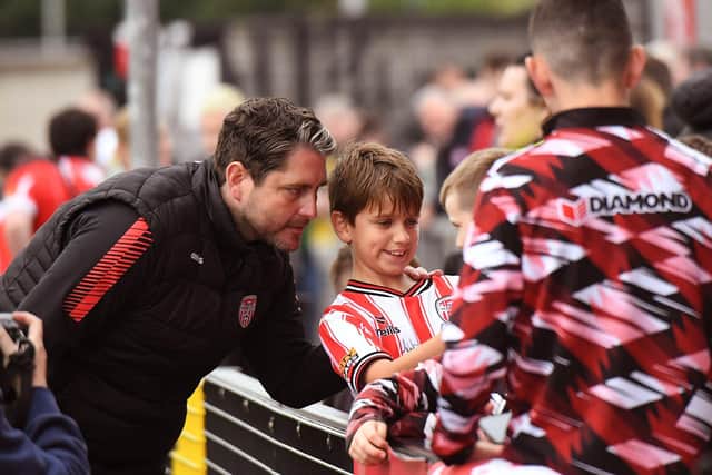 Derry City manager Ruaidhri Higgins poses for a selfie with a young fan. Photograph: George Sweeney