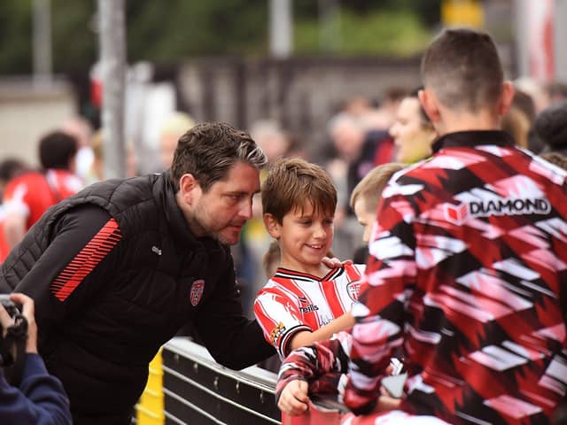 Derry City manager Ruaidhri Higgins poses for a selfie with a young fan. Photograph: George Sweeney