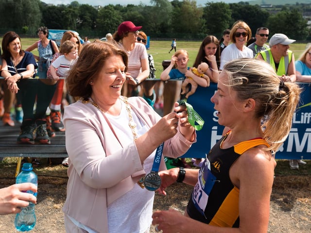 Mayor of Derry City and Strabane District Council, Councillor Patricia Logue presents Claire McGuigan with her runner-up medal in the ladies' competition. (Photo: Karol McGonigle_