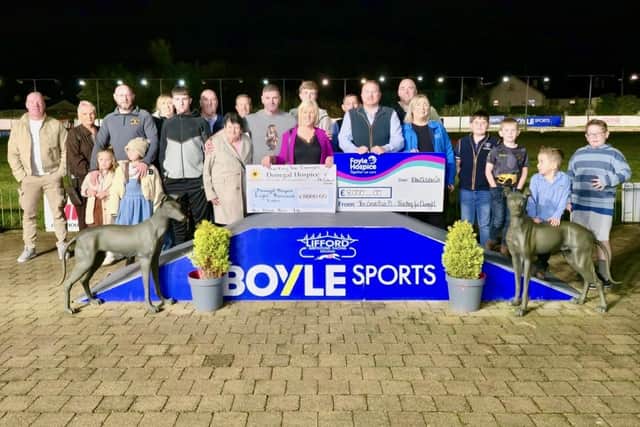 The organising committee of last week's Bear Run Motor Show fundraiser present cheques for E8,000 each to Donegal Hospice and Foyle Hospice.