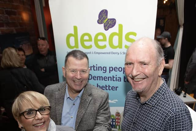 DEEDS CHEQUE. . . . .Sinead Devine, Co-Ordinator, DEEDS, Old Library Trust, accepting a cheque for £5,610 from Willie Barrett, proceeds of monies collected during the Gweedore Reunion 2024 event. In centre is Peter Cunnah from D:Ream. (Photo: Jim McCafferty Photography)