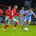 Derry City midfielder Joe Thomson keeps a close eye on Sligo Rovers striker Aidan Keena, during Monday night's game.