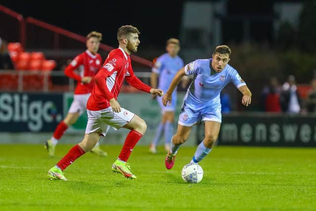 Derry City midfielder Joe Thomson keeps a close eye on Sligo Rovers striker Aidan Keena, during Monday night's game.