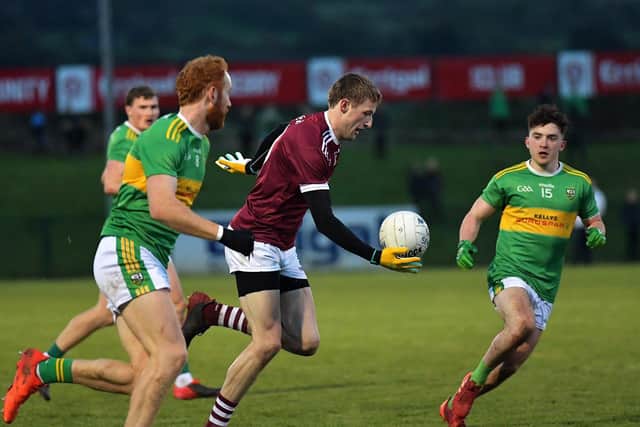 Brendan Rodgers of Slaughtneil’s chased by Glen’s Conor Glass and Conleth McGuckian during Sunday’s SFC semi-final at Owenbeg. Photo: George Sweeney