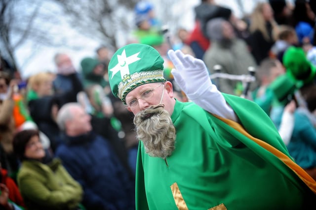 St Patrick waves to the crowds in Derry on Sunday. (1803SL73)