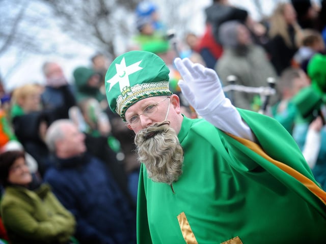 St Patrick waves to the crowds in Derry on Sunday. (1803SL73)