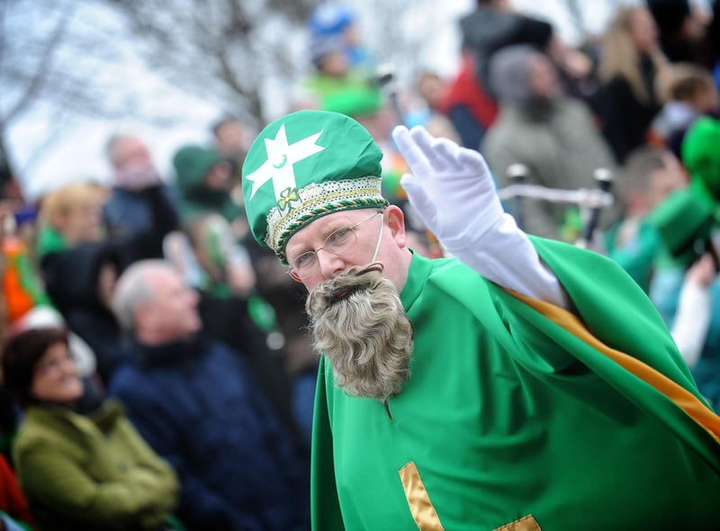 St Patrick waves to the crowds in Derry on Sunday. (1803SL73)