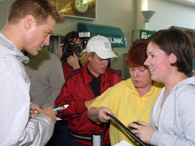 Rock Star Bryan Adams signs his autograph for 21 year old fan Carla McClintock of Culmore and her mum Pat when he arrived at Derry Airport yesterday afternoon.(2408JB11)
