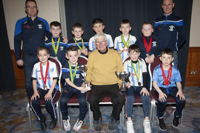 John ‘Jobby’ Crossan presenting the U9 Summer Premier Plate and the Winter Premier Cup to Strabane at the Annual Awards in the City Hotel on Friday night last. Included are coaches Ryan Coyle and Neil Conroy.