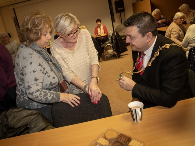Rathmor Women's Club ladies Bridie Doherty and Clare Barbour getting a close look at the Mayor's chain on Tuesday morning. : Mayor visits Rathmore 50+ Women's Club.