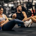 Man and woman working out in a gym.