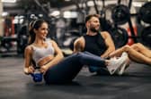 Man and woman working out in a gym.