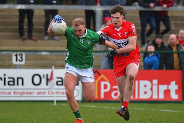 Derry’s Eoin McEvoy grapples with Adrain Enright of Limerick during their Division Two opener at Owenbeg on Saturday afternoon. Photo: George Sweeney. DER2305GS – 140