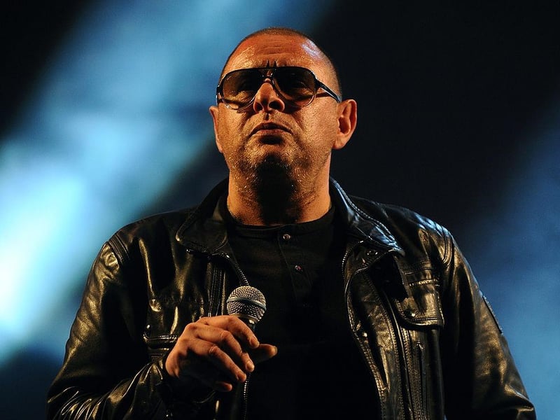 Shaun Ryder from Happy Mondays is set to play at Sandinos this Friday. Doors open at 6:30 pm, and tickets are priced from £33.22. (Photo by Rob Harrison/Getty Images)