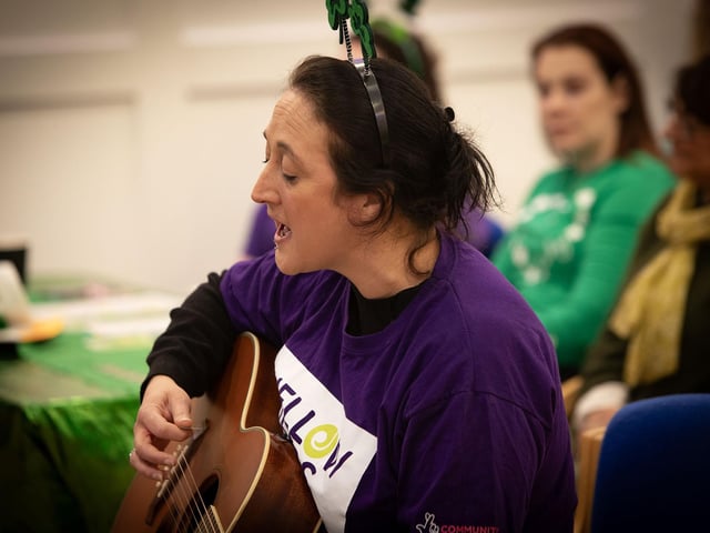 Concert director Anna Nolan leading the way on St. Patrick's Day.