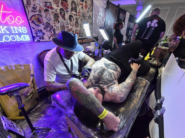 Tattoo artists at the annual Maiden City Ink International Tattoo Convention held in the Everglades Hotel. Photo: George Sweeney